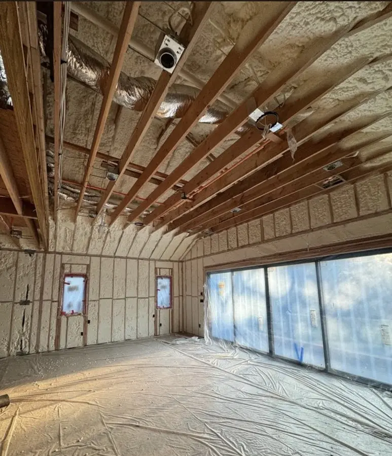 Interior walls and ceiling insulated with spray foam during new construction in East Liverpool